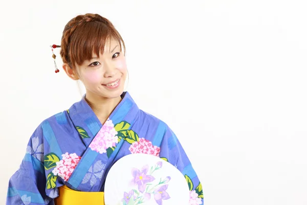 Young woman with paper Fan　 — Stock Photo, Image